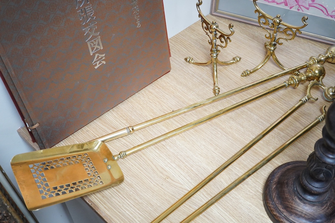 Three brass andirons and two trivets